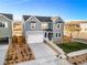 Two-story home featuring a two-car garage, well-maintained lawn and contemporary architectural details at 9359 Russell Cir, Arvada, CO 80007