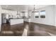 Modern kitchen with stainless steel appliances, white cabinets, and sleek countertops at 9359 Russell Cir, Arvada, CO 80007