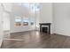 Bright living room featuring large windows, high ceilings, and a modern fireplace at 9359 Russell Cir, Arvada, CO 80007