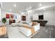 Spacious living room featuring comfortable seating, a pool table, and modern decor at 9359 Russell Cir, Arvada, CO 80007