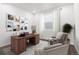 Cozy home office with a wooden desk, comfortable seating, and natural light, creating a productive workspace at 9359 Russell Cir, Arvada, CO 80007