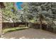 A fenced backyard with a small patch of grass and concrete patio at 5463 Rockhampton Cir, Highlands Ranch, CO 80130