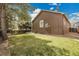 Exterior view of the home's backyard featuring green grass at 5463 Rockhampton Cir, Highlands Ranch, CO 80130