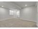 Finished basement area with neutral carpeting, recessed lighting, and a laundry closet at 5463 Rockhampton Cir, Highlands Ranch, CO 80130