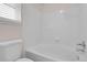 Bathroom featuring a white subway tile shower and white toilet at 5463 Rockhampton Cir, Highlands Ranch, CO 80130