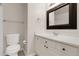 Bright bathroom with a white vanity and framed mirror at 5463 Rockhampton Cir, Highlands Ranch, CO 80130