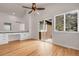 Bright bedroom with vaulted ceilings, hardwood floors, built-in desk and a sliding door to the outside at 5463 Rockhampton Cir, Highlands Ranch, CO 80130