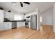 Modern kitchen with stainless steel appliances, white cabinets, sleek countertops, and hardwood floors at 5463 Rockhampton Cir, Highlands Ranch, CO 80130