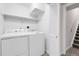 Laundry area with washer and dryer and a louvered door storage cabinet at 5463 Rockhampton Cir, Highlands Ranch, CO 80130