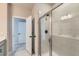 Clean bathroom with a walk-in shower and neutral tile at 786 Sawdust Dr, Brighton, CO 80601