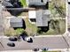 Aerial shot of a property showcasing the house, garage, and surrounding landscape at 2201 Illinois St, Golden, CO 80401