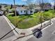 Charming exterior featuring a well-kept lawn and mature trees on a corner lot at 2201 Illinois St, Golden, CO 80401