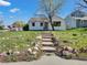 Welcoming front exterior with stone steps leading to a cozy home entrance at 2201 Illinois St, Golden, CO 80401