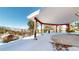 Covered patio with mountain views and snowy landscape at 2824 Valley Park Dr, Larkspur, CO 80118