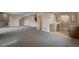 Finished basement featuring a stone fireplace, bar area, and plush carpeting, great for entertaining at 4121 Mesa Top Dr, Monument, CO 80132