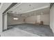 Spacious garage with high ceilings, concrete floors, and automatic door at 4121 Mesa Top Dr, Monument, CO 80132