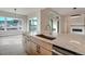 Contemporary kitchen featuring a large island, modern fixtures, and stunning views of the mountains at 4121 Mesa Top Dr, Monument, CO 80132