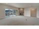 Spacious living room with a stone fireplace, recessed lighting, and mountain views from the sliding glass door at 4121 Mesa Top Dr, Monument, CO 80132
