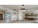 Open living space with kitchen and modern glass enclosed office at 4121 Mesa Top Dr, Monument, CO 80132
