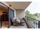 Relaxing balcony with outdoor seating offering a peaceful view of the surrounding greenery at 13961 E Marina Dr # 414, Aurora, CO 80014