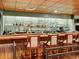 A commercial bar area featuring bar stools and mirrored shelving with liquor bottles at 13961 E Marina Dr # 414, Aurora, CO 80014