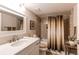 Bright bathroom featuring a shower over tub with subway tiles and a white vanity at 13961 E Marina Dr # 414, Aurora, CO 80014