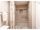 Modern bathroom with tiled walk-in shower and glass door at 13961 E Marina Dr # 414, Aurora, CO 80014