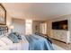 Spacious bedroom with wood floors, white dresser, and a view to the bathroom at 13961 E Marina Dr # 414, Aurora, CO 80014