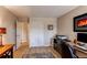 Well-lit bedroom featuring wood floors, closet and work area with desk and chair at 13961 E Marina Dr # 414, Aurora, CO 80014