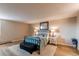 Spacious bedroom with an iron bed, neutral walls, and a plush rug at 13961 E Marina Dr # 414, Aurora, CO 80014