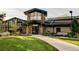 Exterior daytime view of a commercial building with stone and wood accents at 13961 E Marina Dr # 414, Aurora, CO 80014