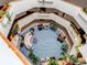 Open air lobby with furniture and lots of plants at 13961 E Marina Dr # 414, Aurora, CO 80014