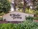 Heather Gardens sign with green shrubs in front of the wall at 13961 E Marina Dr # 414, Aurora, CO 80014