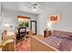 Bright bedroom with a desk area, bed, and vibrant rug adding a cozy touch at 3313 S Dexter St, Denver, CO 80222
