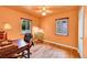 Cozy bedroom featuring hardwood floors, two windows, and a ceiling fan with lighting at 3313 S Dexter St, Denver, CO 80222