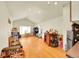 Spacious bonus room with hardwood floors, ample lighting, and a vaulted ceiling at 3313 S Dexter St, Denver, CO 80222