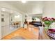 Open-concept living and dining area with hardwood floors and comfortable furnishings at 3313 S Dexter St, Denver, CO 80222
