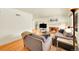 Bright living room featuring hardwood floors, a fireplace, and open layout at 3313 S Dexter St, Denver, CO 80222
