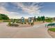 Attractive community playground featuring play structures, lush landscaping, and seating areas for Gathering enjoyment at 10909 Memphis Ct, Commerce City, CO 80022