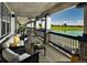 Relaxing outdoor patio overlooking a lake, featuring comfortable seating and scenic views, perfect for leisure at 10909 Memphis Ct, Commerce City, CO 80022