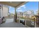 Covered patio with stone columns offering shade and a view of the backyard, perfect for outdoor relaxation at 10909 Memphis Ct, Commerce City, CO 80022