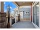 Charming porch with stone accents offering a relaxing view of the neighborhood, and a slider door at 10909 Memphis Ct, Commerce City, CO 80022
