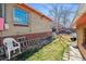 Lawn and brickwork in a residential backyard with mature trees at 2301 Vine St, Denver, CO 80205