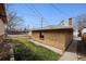 Backyard view features a detached garage with grassy area at 2301 Vine St, Denver, CO 80205