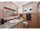 Retro pink bathroom featuring classic tile, vanity, and walk-in shower at 2301 Vine St, Denver, CO 80205