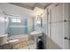 Charming bathroom featuring classic tiling, pedestal sink, and bathtub at 2301 Vine St, Denver, CO 80205