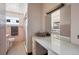 Bathroom featuring a vanity area, pink tile, and a shower at 2301 Vine St, Denver, CO 80205