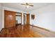 Large bedroom with hardwood floors and closet with sliding doors at 2301 Vine St, Denver, CO 80205
