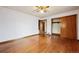 Spacious bedroom with hardwood floors and closet with wood sliding doors at 2301 Vine St, Denver, CO 80205