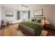 Cozy bedroom with hardwood floors, sitting area, and ample natural light at 2301 Vine St, Denver, CO 80205